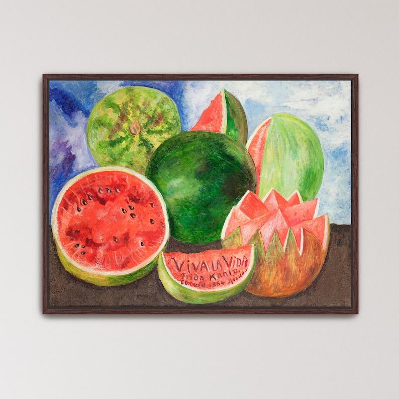May include: A framed watercolor painting of watermelons. The painting features several whole and sliced watermelons in shades of green and red. The text "VIVA LA VIDA" is visible on a watermelon slice, along with the artist's name and the year 1954.