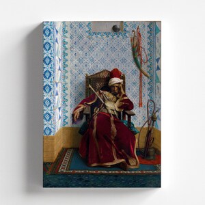 May include: A man in a red and gold robe sits on a throne with a patterned background. He is holding a sword and has a red hat on his head.