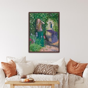 May include: A framed painting depicts a woman in a garden. She wears a pink top and green skirt, standing near flowers and foliage. A purple structure is in the background, with a stone archway and a glimpse of a figure. The artwork has a classical style.