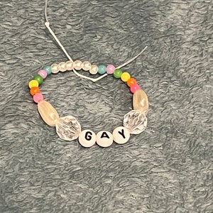 Pride themed friendship bracelet “Gay”