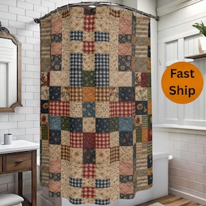 May include: A patchwork shower curtain with a variety of patterned squares in shades of red, blue, green, and tan. The curtain is hanging in a bathroom with white tile and a wooden vanity.