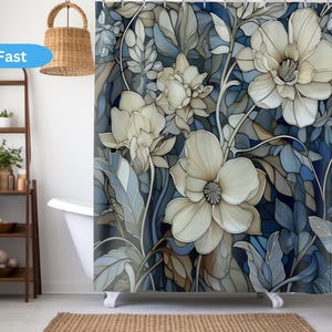 May include: A shower curtain featuring a floral design with large white flowers and blue leaves. The flowers have a stained glass effect and are set against a dark blue background.