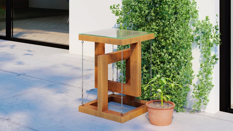 May include: A wooden side table with a glass top and a unique, geometric design. The table is suspended by chains and has a rustic, natural finish.