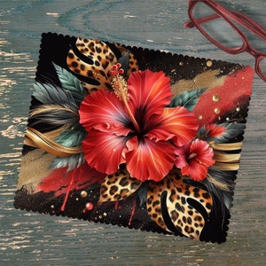 May include: A black microfiber cleaning cloth with a red hibiscus flower, gold accents, and a leopard print design.