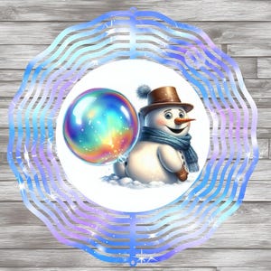 May include: A blue and purple wind spinner with a snowman holding a rainbow bubble. The snowman is wearing a brown hat and a blue scarf.