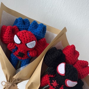 May include: Two bouquets of crocheted Spider-Man roses wrapped in brown paper with tags that say "CHIVY GARDEN".