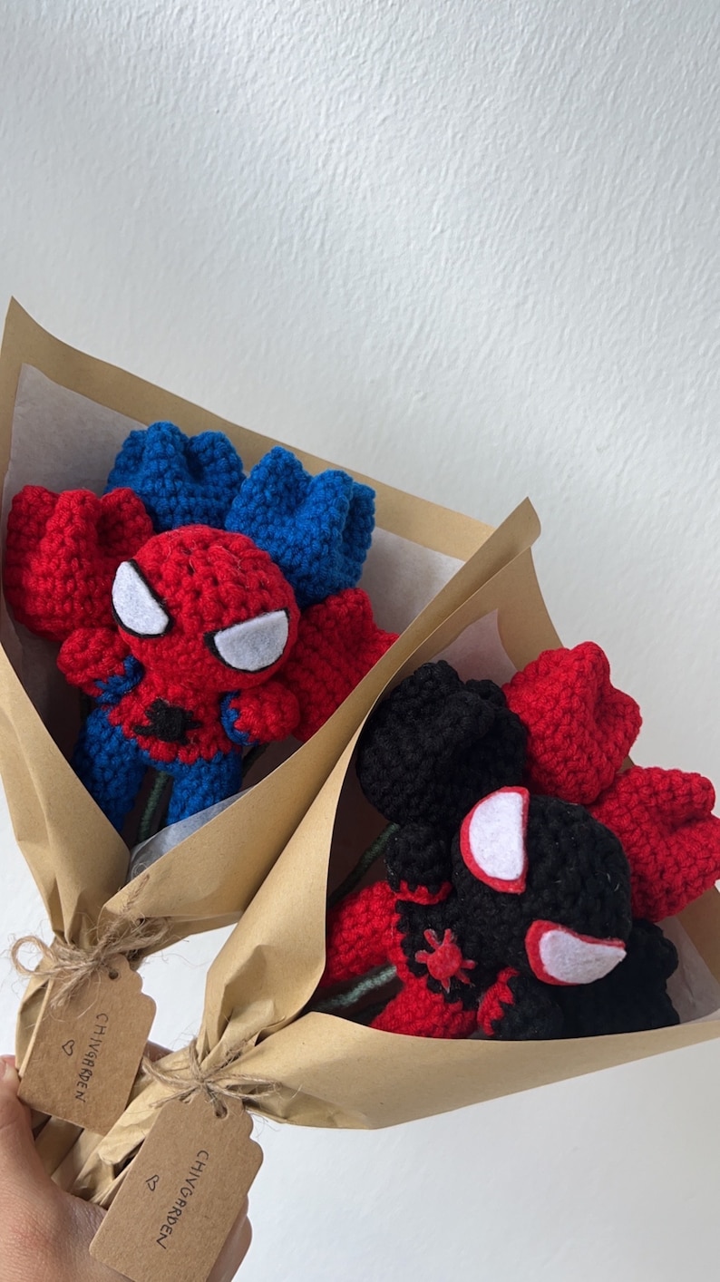May include: Two bouquets of crocheted Spider-Man roses wrapped in brown paper with tags that say "CHIVY GARDEN".