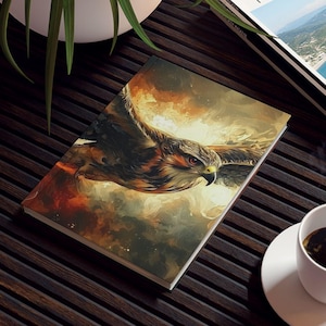 May include: A dark wooden coffee table with a magazine, a book, a cup of coffee, and a potted plant. The magazine is titled "TRAVEL MAGAZINE". The book cover features a painting of a hawk in flight.