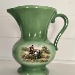 May include: A set of three ceramic mugs with a speckled, matte finish. Each mug features a different color: light blue, cream, and gray. The mugs have a simple, modern design and a comfortable handle.