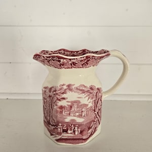 May include: A set of three ceramic mugs with a speckled, matte finish. The mugs are in shades of cream, light gray, and dark gray. Each mug has a simple, minimalist design, perfect for coffee or tea.