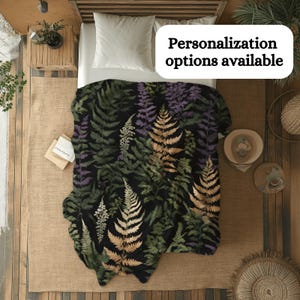 May include: A black and green throw blanket with a fern pattern. The blanket is made of soft, comfortable fabric and is perfect for adding a touch of nature to your home decor.
