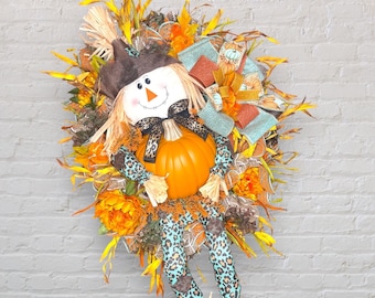 Oversized Scarecrow and pumpkin Fall wreath, Autumn Door Decor, Orange florals, teal leopard print, Handmade wreath for front door