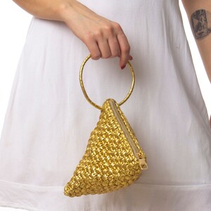 A stunning handmade metallic yellow evening bag with a leather look! Enjoy the unique design.