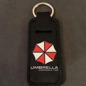Resident Evil/Umbrella Company-sleutelhanger met cadeauzakje