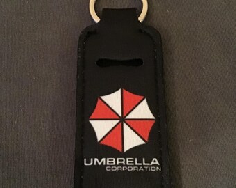 Resident Evil/Umbrella Company Schlüsselanhänger mit Geschenktüte