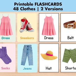 May include: Printable flashcards featuring clothing items. The cards display a pink dress, red sneakers, a brown belt, purple socks, blue jeans, a yellow hat with a pink band, and green shorts. The text on the cards reads "Dress", "Sneakers", "Belt", "Socks", "Jeans", "Hat", and "Shorts".