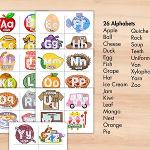 May include: Educational alphabet flashcards featuring colorful illustrations for each letter, including an apple, ball, cheese, duck, egg, fish, grape, hat, ice cream, jam, kiwi, leaf, mango, nest, orange, and pie. The text "26 Alphabets" is also included.