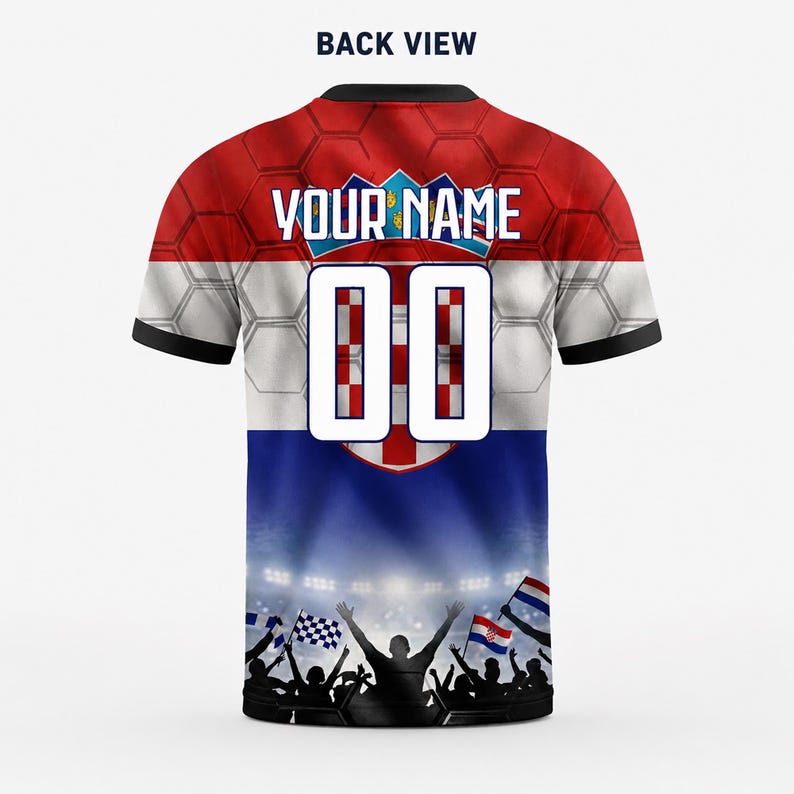 May include: A short-sleeve jersey featuring a red, white, and blue Croatian flag pattern with a honeycomb texture. The back displays the text "YOUR NAME" above the number "00" and a graphic of a cheering crowd with flags at the bottom.
