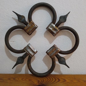Elegant Wrought Iron  Wall Decor - Timeless Artistry for Your Space.