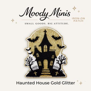 May include: An iron-on patch featuring a black haunted house silhouette against a gold glitter moon background. The design includes black bats, bare trees, and small crosses. Text reads Moody Minis, IRON-ON PATCH, SMALL GOODS. BIG ATTITUDE., and Haunted House Gold Glitter.