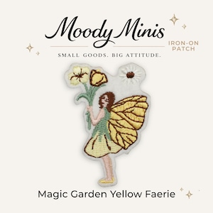 May include: An embroidered iron-on patch featuring a faerie with brown hair and large yellow wings, holding a bouquet of yellow and white flowers. The text Moody Minis, IRON-ON PATCH, SMALL GOODS. BIG ATTITUDE., and Magic Garden Yellow Faerie is visible.