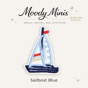May include: An embroidered iron-on patch featuring a sailboat with a dark blue hull, white sails, and red and yellow accents. The text Moody Minis, IRON-ON PATCH, SMALL GOODS. BIG ATTITUDE., and Sailboat Blue is printed around the patch design.