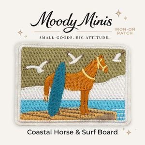 May include: A rectangular iron-on patch featuring an embroidered scene of a brown horse standing on a tan beach next to a blue surfboard. The background includes a light blue ocean, a muted green sky, and three white seagulls. Text reads Moody Minis.