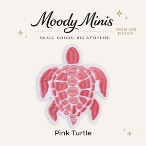 May include: An iron-on patch featuring a pink turtle with a white border. The text Moody Minis, IRON-ON PATCH, SMALL GOODS. BIG ATTITUDE., and Pink Turtle are visible. The turtle has a detailed shell pattern with various shades of pink embroidery.