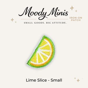 May include: An embroidered iron-on patch shaped like a lime slice with a bright yellow center, white segments, and a vibrant green rind. The text Moody Minis, IRON-ON PATCH, SMALL GOODS. BIG ATTITUDE., and Lime Slice - Small are printed on the card.