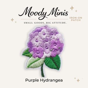 May include: An embroidered iron-on patch featuring a purple hydrangea flower with green leaves. The text Moody Minis, IRON-ON PATCH, SMALL GOODS. BIG ATTITUDE., and Purple Hydrangea are visible. The design uses shades of purple, white, and green.