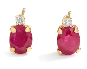 Oval Ruby and diamond stud earrings in 14kt Yellow gold
