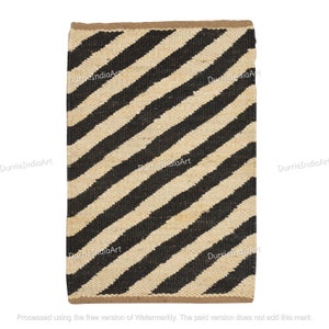 May include: A black and white striped jute rug with a diagonal pattern. The rug is made of natural fibers and has a rustic look.
