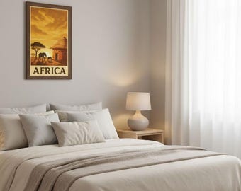May include: A framed print depicting an African landscape with a sunset, an elephant, and a building. The word "AFRICA" is printed at the bottom. The print hangs above a bed with white bedding and a beige throw blanket. A lamp sits on a nightstand.