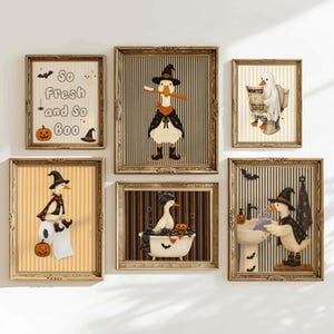 May include: A set of six framed wall art prints featuring illustrations of ducks in Halloween costumes. The prints include a duck brushing its teeth, a duck in a bathtub, a duck at a sink, a duck on toilet paper, a ghost duck, and text reading So Fresh and So Boo.