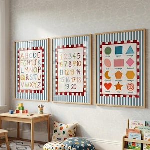 May include: Three framed wall art prints featuring educational themes: the alphabet, numbers one through twenty, and various geometric shapes. Each print is set against a blue and white striped background with a red and white checkered border.