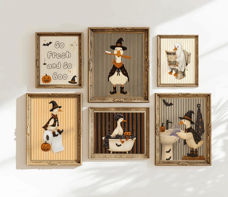 May include: A set of six framed wall art prints featuring illustrations of ducks in Halloween costumes. The prints include a duck brushing its teeth, a duck in a bathtub, a duck at a sink, a duck on toilet paper, a ghost duck, and text reading So Fresh and So Boo.