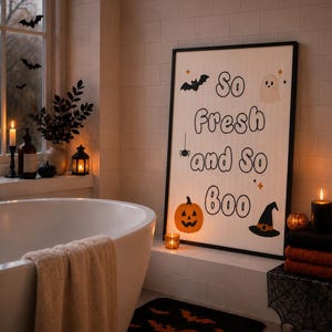 May include: A rectangular framed wall art piece featuring the text So Fresh and So Boo in a bold black font. The design includes illustrations of a black bat, a white ghost, a black spider, an orange jack-o'-lantern, and a black witch hat.