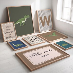 May include: A collection of framed dinosaur-themed art prints. The prints feature illustrations of dinosaurs, dinosaur footprints, and the letter "W". Some prints include text that reads "RAWR means I love you in DINOSAUR" and "Little man cave".
