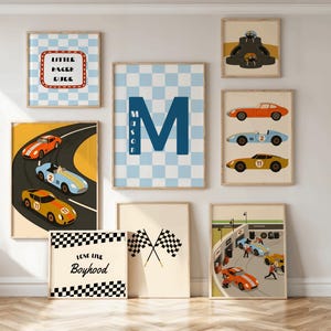 May include: A collection of framed art prints with a racing theme. The prints feature race cars, checkered flags, and the text "Little Racer Dude" and "Love the Boyhood". The color palette includes blue, orange, yellow, and black.