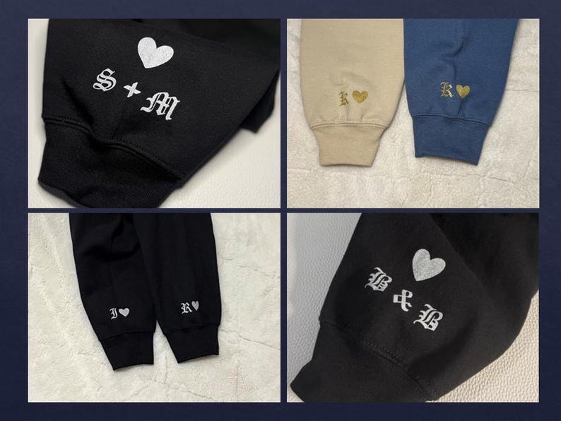 May include: Close-up of four different sweatshirt sleeves. Each sleeve features embroidered initials and a heart symbol. Colors include black, tan, and blue. The initials are in a gothic font.