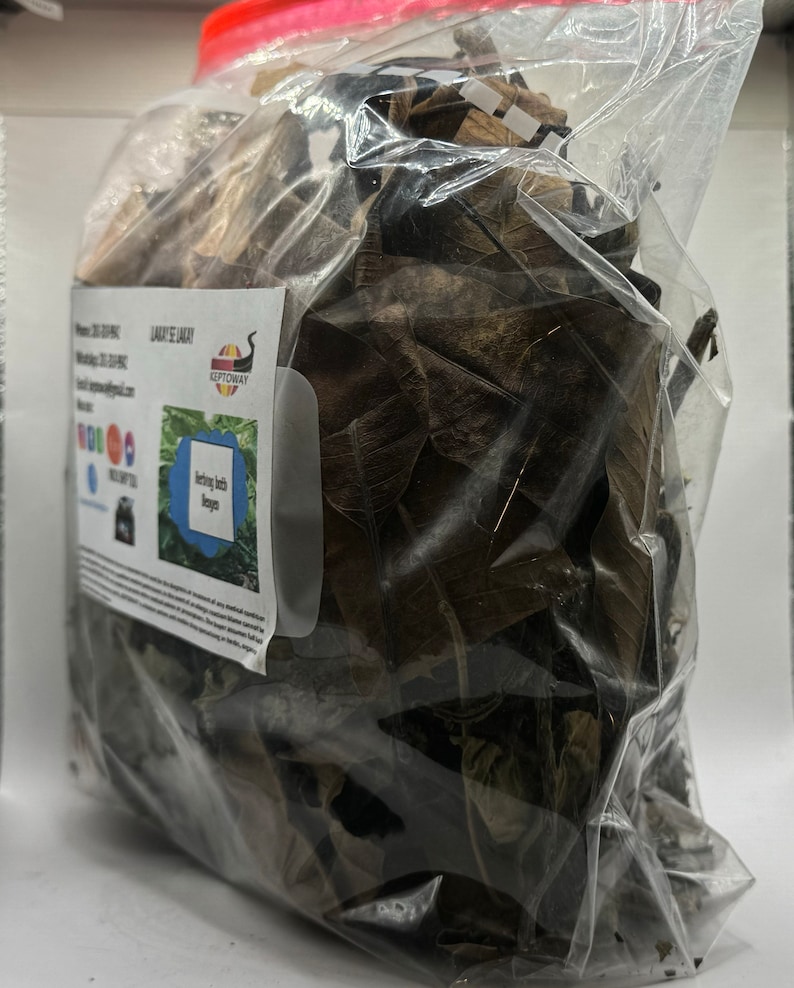 May include: A clear plastic bag filled with dried brown and green leaves. The bag has a label that says "KEEPTOWAY" and "Herbs Bath  Recipes".