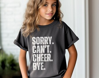 May include: A dark gray t-shirt with the text "SORRY. CAN'T. CHEER. BYE." printed in white.