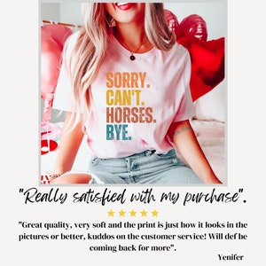 May include: A pink t-shirt with the text "SORRY. CAN'T. HORSES. BYE." in colorful letters. The shirt is being worn by a person. The text is in a vintage style font.
