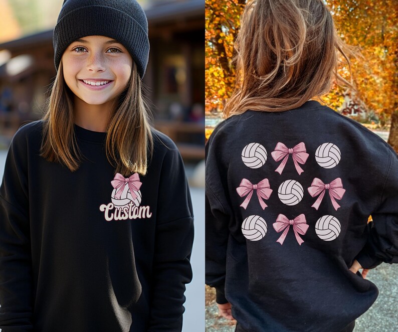 May include: Black sweatshirt with a volleyball and pink bow design on the front and a pattern of volleyballs with pink bows on the back. The text "Custom" is on the front of the sweatshirt.