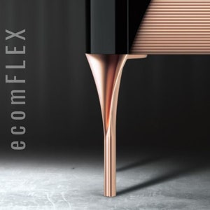 May include: Close-up of a rose gold metal table leg with a sleek, modern design. The leg is slender and tapers to a point at the bottom.
