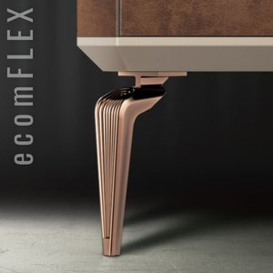 May include: A close-up of a furniture leg with a rose gold finish. The leg has a curved design with vertical lines and a flat base. The top of the leg connects to a white and brown cabinet. The text "ecomFLEX" is on the left side.