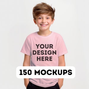 May include: A young person wearing a pink t-shirt with the text "YOUR DESIGN HERE" printed on the front. The t-shirt is a mockup for a design.