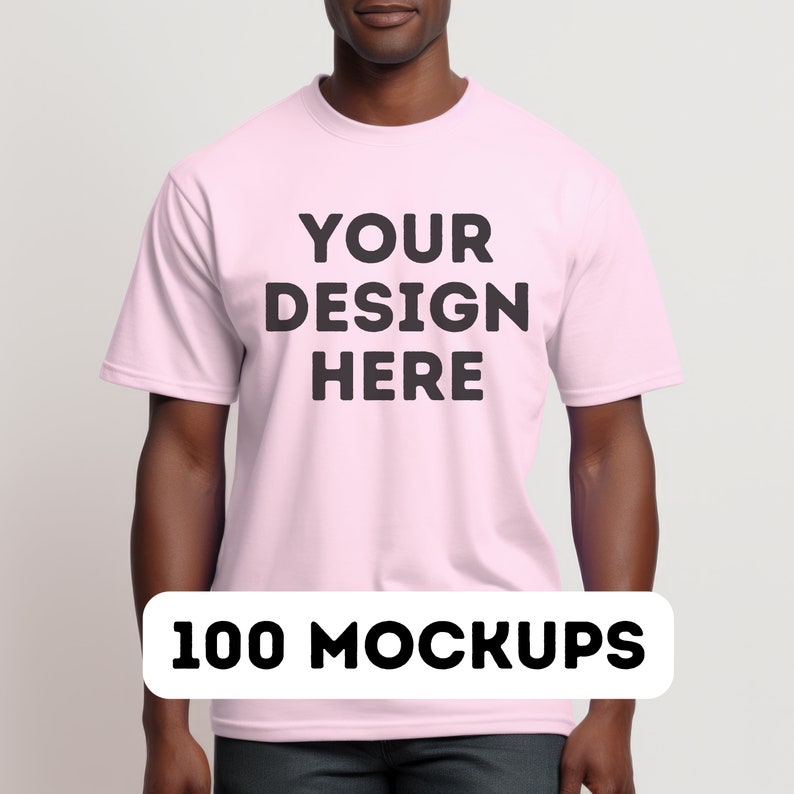 May include: A pink t-shirt with the text "YOUR DESIGN HERE" printed on the front. 100 MOCKUPS.