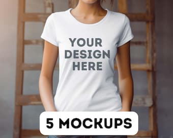May include: A white t-shirt with the text "YOUR DESIGN HERE" printed on the front. The t-shirt is being worn by a person with their hands in their pockets. The text "5 MOCKUPS" is printed in black on a white rectangle at the bottom of the image.