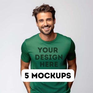 May include: A green t-shirt mockup with the text "YOUR DESIGN HERE" printed on the front. The text is in black and the shirt is being worn by a person with a smiling face. The text "5 MOCKUPS" is printed in black on a white rectangle at the bottom of the image.